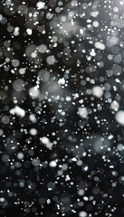 Falling snow flakes isolated on black background