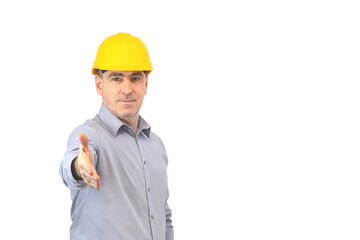 A man in a helmet shows a gesture with his hands. A man builder   presenting  hands