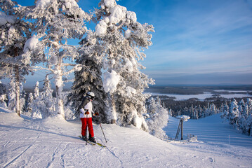 Woman downhill skiing in Lapland Finland