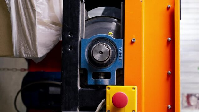 vertical video Close-up Big red button to turn on and off the movement of the belt on a waste sorting line in factory