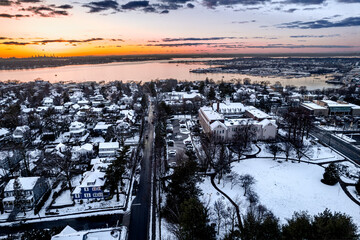 Aerial drone photo of a snowy sunset over the North Shore of Long Island 