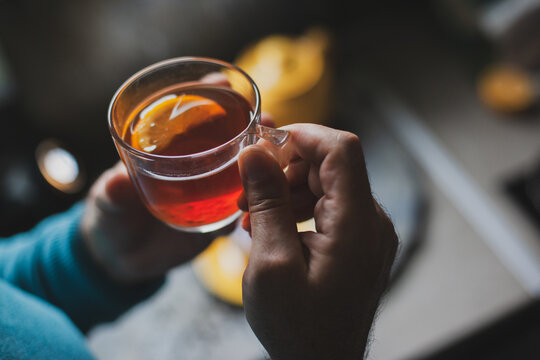 Hot tea cup and cozy relaxation moment at home