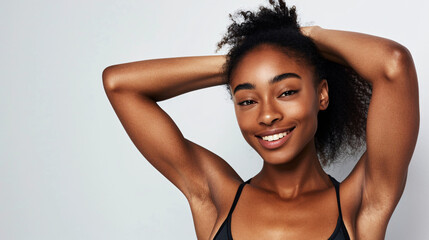 young beautiful sport influencer women showing armpit with smooth clean skin on solid background - obrazy, fototapety, plakaty