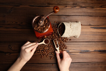 a hands and coffee grinder