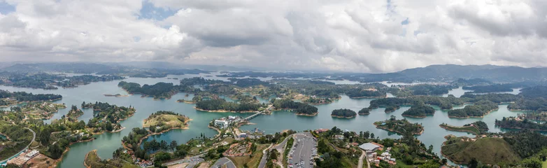Foto op Canvas Panoramic view of the man-made Peñol-Guatapé Reservoir with its many small islands and bays and the town of Guatapé in Colombia. © Milan