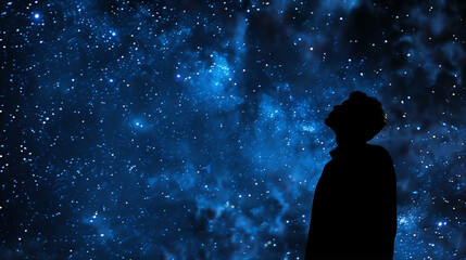 Silhouette of a man looking up at the stars, vast night sky, feeling of wonder and the vastness of the universe
