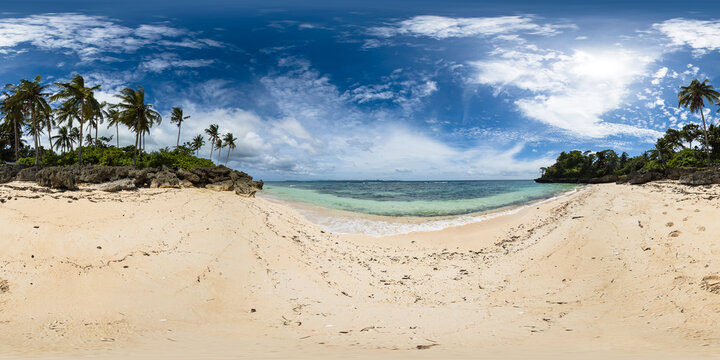 Tropical beach with coconut trees and waves on sand. Carabao Island in Romblon, Philippines. VR 360.