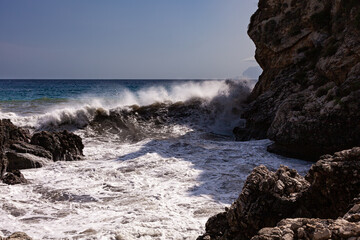 Waves breaking over rocks in Sicily - 738922407