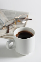 Coffee, newspaper and glasses