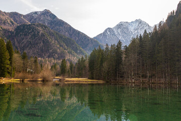 A scenic lake with mountains in the background