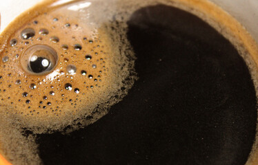 Background with delicious coffee with bubbles and foam. Morning invigorating drink. Stock photo of...