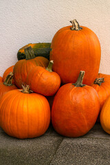Beautiful orange pumpkins decorate the street for the holiday.