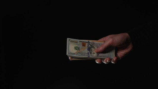 Transfer of a large amount of money on a black background after bank fraud