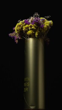 Vertical NATO artillery caliber artillery ammunition casing on rotation table from american artillery gun 155mm caliber M777 howitzer