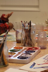 Children paint with pencel and paint. Art in preschool.