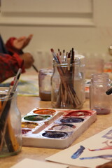 Children paint with pencel and paint. Art in preschool.