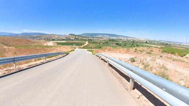 French Way of Saint James - a secondary paved road with a view to Navarrete, province of La Rioja, Spain 