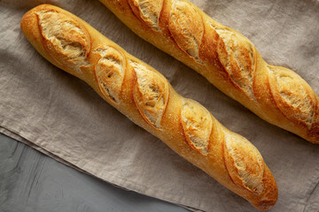 Homemade French Bread Baguette on a gray background, top view.