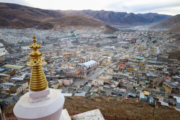 Experience tranquility amidst the majestic beauty of Tibet's Amdo region as the setting sun casts a...
