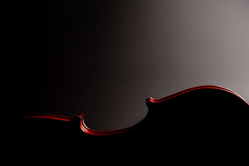 Violin, wonderful details of a beautiful violin, dark background, selective focus.