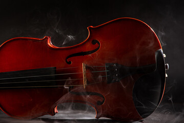 Violin and smoke, wonderful details of a beautiful violin with smoke in the environment, dark...