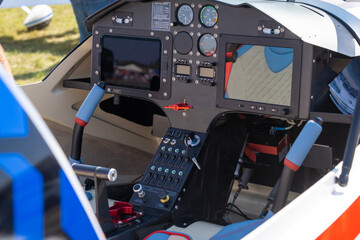 Modern two-seater small helicopter cockpit - obrazy, fototapety, plakaty
