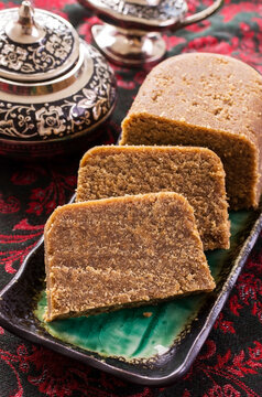 Traditional Arabic sweet halava cake offered as close-up on a design tray