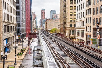 Fototapeta na wymiar Empty elevated tracks with switches and signals in downtown Chicago on a cloudy srping day