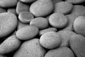 Fototapeta na wymiar Sea of pebbles wallpaper. Gray beach stones background. For banner, postcard page, template