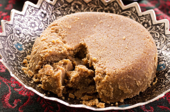 Traditional Arabic sweet halava cake offered as close-up in a classic bowl