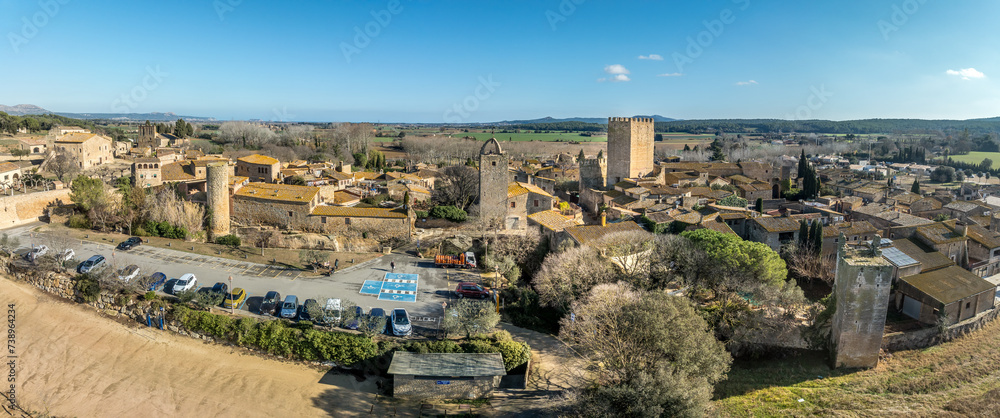 Wall mural Aerial view of Peratallada, historic artistic small fortified medieval town with castle  in Catalonia, Spain near the Costa Brava. Stone buildings rutted stone streets and passageways.