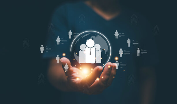 Human resources management or HRM, Recruitment employment headhunting concept. Businessman holding global structure customer network for manage team leader. Data person management in the organization.