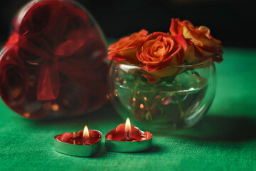 Bouquet of roses, candles and gifts, card for February 14, Valentine's Day, March 8, International Women's Day, wedding, birthday, mother's day, blurred background, bokeh.