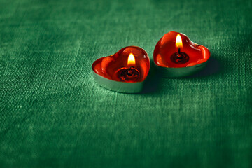 Two burning candles, place for text, card for February 14, Valentine's Day, March 8, International Women's Day, wedding, birthday, mother's day, blurred background, bokeh.