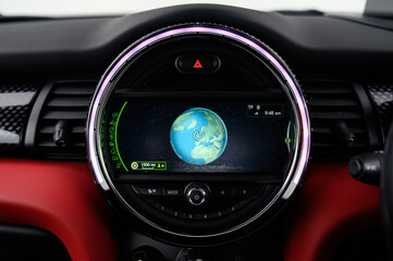 Satellite navigation system in a car showing the globe