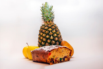 Delicious pie stands on a background of fruits	
