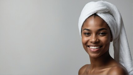 Portrait of smiling young black woman with white towel on head plain bright white background bright white studio lighting from Generative AI