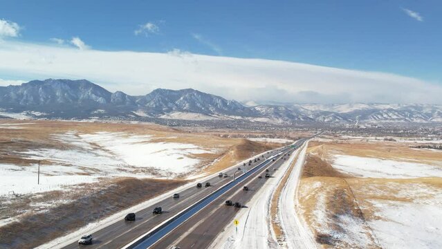 A fixed shot highlights the tranquil scenery of Boulder, Colorado, with Highway 36 winding through the landscape.
