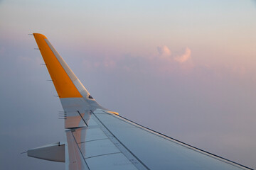 fly to Turkey on vacation by plane in the morning during a beautiful sunrise