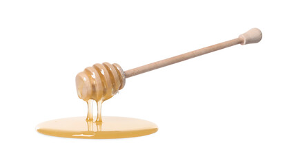 Natural honey dripping from dipper on white background