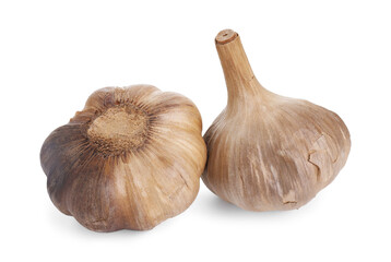 Bulbs of fermented black garlic isolated on white