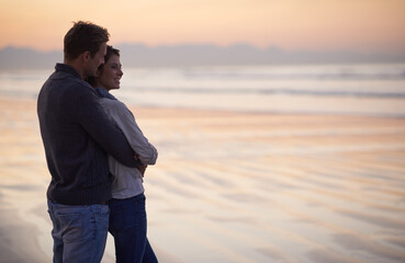 Couple, love and hug on beach at sunset with happiness together on holiday in Florida. Travel,...
