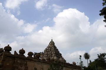 Fototapeta na wymiar Tower of ancient Kanchi Kailasanathar temple in Kanchipuram, Tamilnadu. Historic Tall Hindu Temple Gopuram against cloudy sky background.