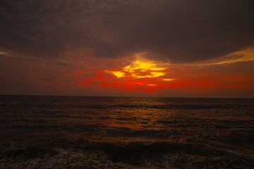 Attractive dramatic red sunset with cloudy sky