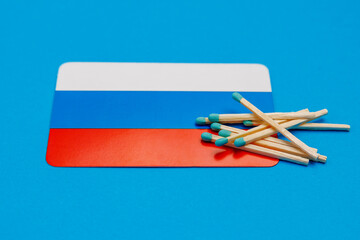 Matches on the background of the Russian flag with selective focus and copy space