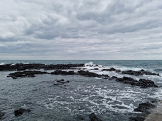 
This is a Jeju Island beach with basalt rocks.