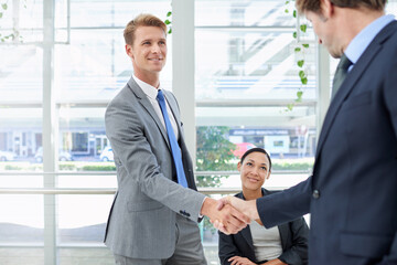 Fototapeta premium Shaking hands, collaboration and business people in office for agreement, partnership or deal. Smile, meeting and professional men with handshake for onboarding or hiring welcome in workplace.