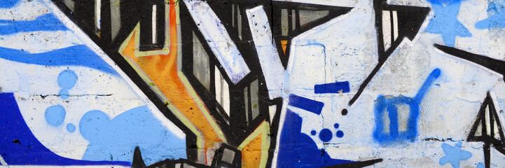 Colorful background of graffiti painting artwork with bright aerosol outlines on wall. Old school...