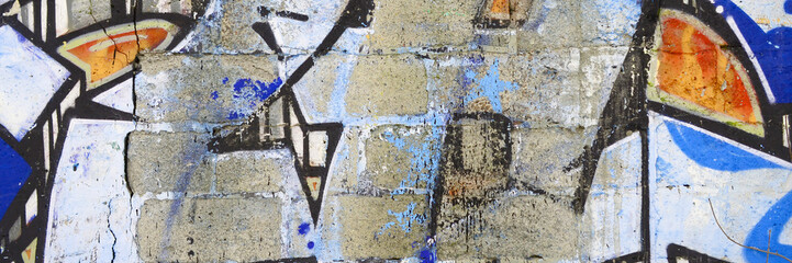 Colorful background of graffiti painting artwork with bright aerosol outlines on wall. Old school...