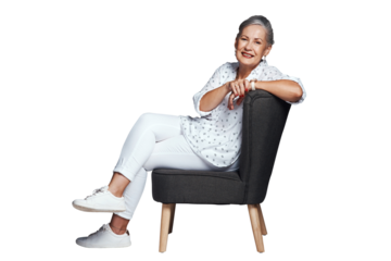 Mature woman, sitting and portrait while smiling, couch and relax for sofa and confidence. Senior female person, fashion and leisure for isolated, transparent and png background for trendy look